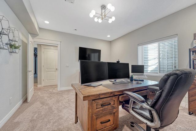 a view of a workspace with furniture