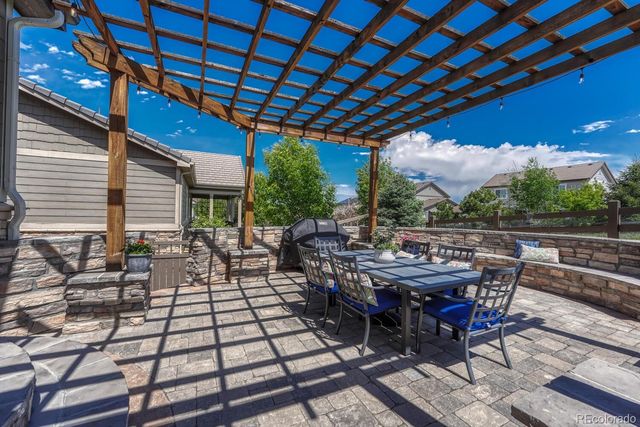 a view of an outside dining space with furniture