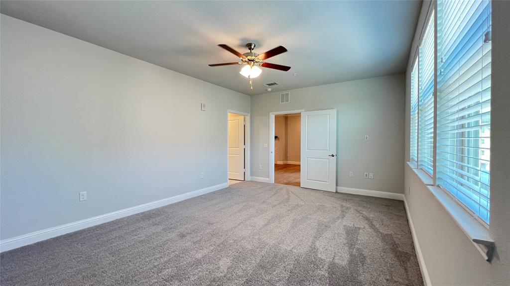651 Watters Road, Unit 3300 Allen, TX 75013 - Photo 15 of 25 Unfurnished bedroom with ceiling fan and light colored carpet