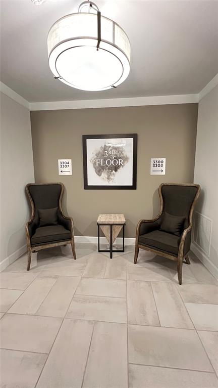 651 Watters Road, Unit 3300 Allen, TX 75013 - Photo 4 of 25 Living area featuring ornamental molding