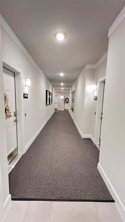 651 Watters Road, Unit 3300 Allen, TX 75013 - Photo 5 of 25 Corridor featuring ornamental molding and tile patterned flooring