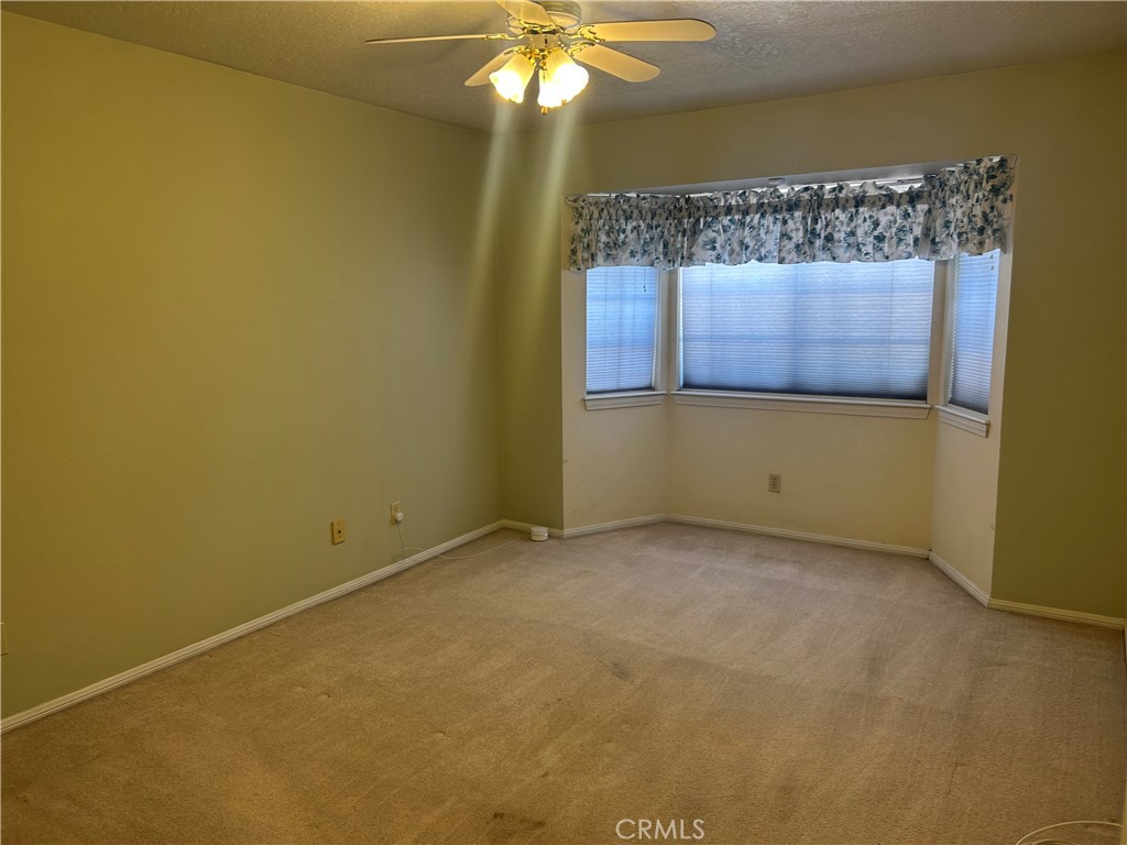 20187 Itasca Road Apple Valley, CA 92308 - Photo 10 of 35 a view of an empty room with a window