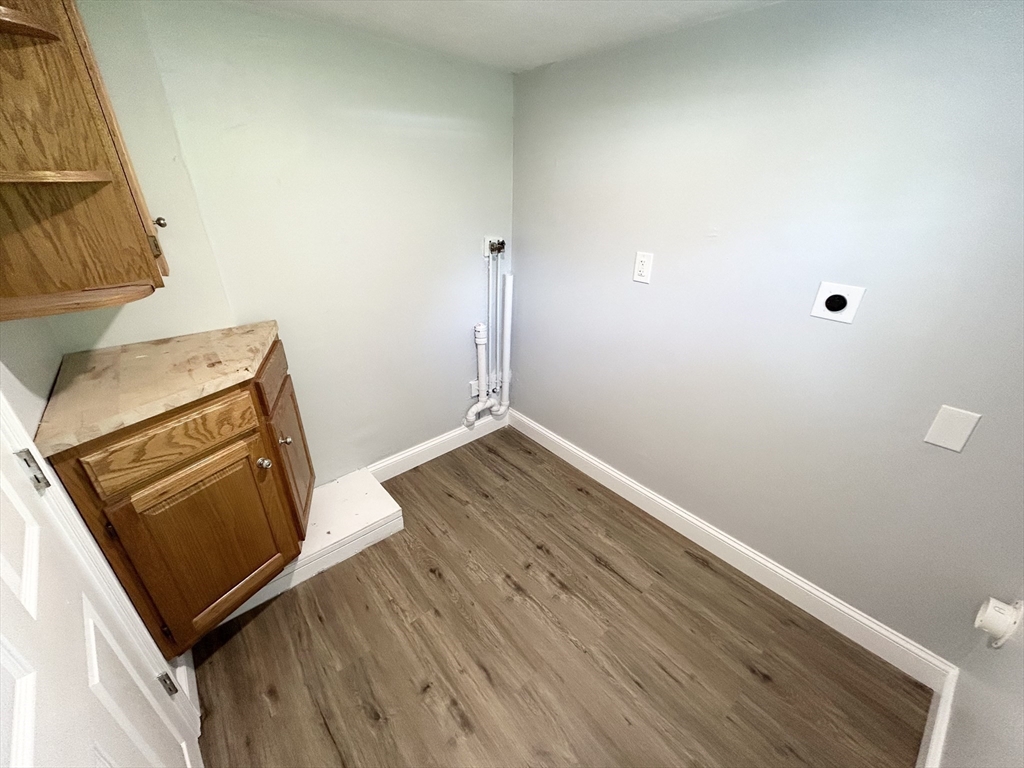 13 Maranook Road Worcester, MA 01606 - Photo 15 of 24 an empty room with wooden floor and cabinet
