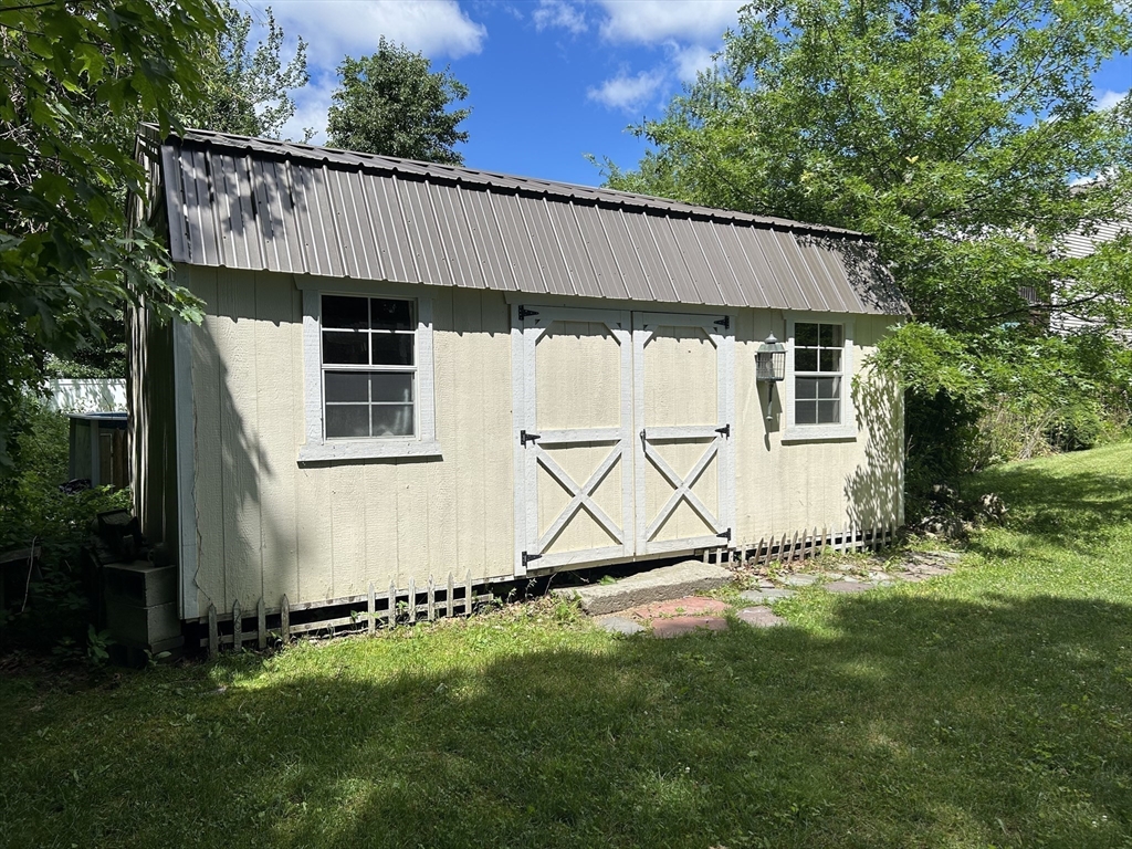 13 Maranook Road Worcester, MA 01606 - Photo 21 of 24 a view of a backyard with a small cabin