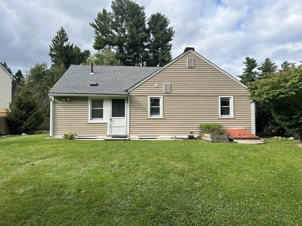 13 Maranook Road Worcester, MA 01606 - Photo 5 of 24 a front view of a house with a yard and garage