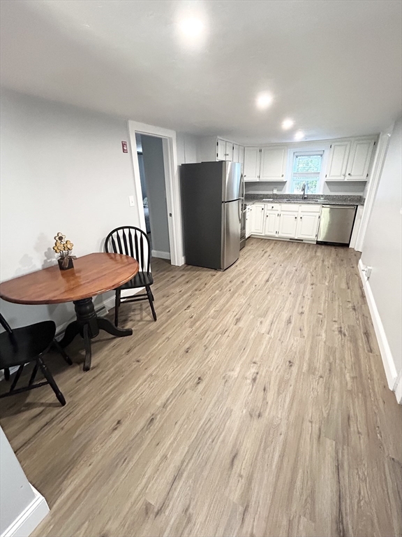 13 Maranook Road Worcester, MA 01606 - Photo 10 of 24 a view of a room with wooden floor and furniture