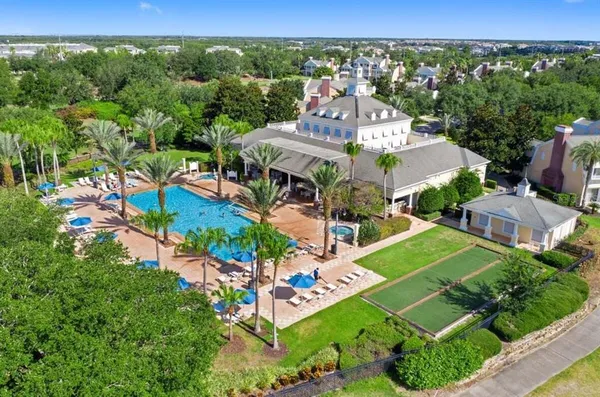 an aerial view of residential houses with outdoor space and street view