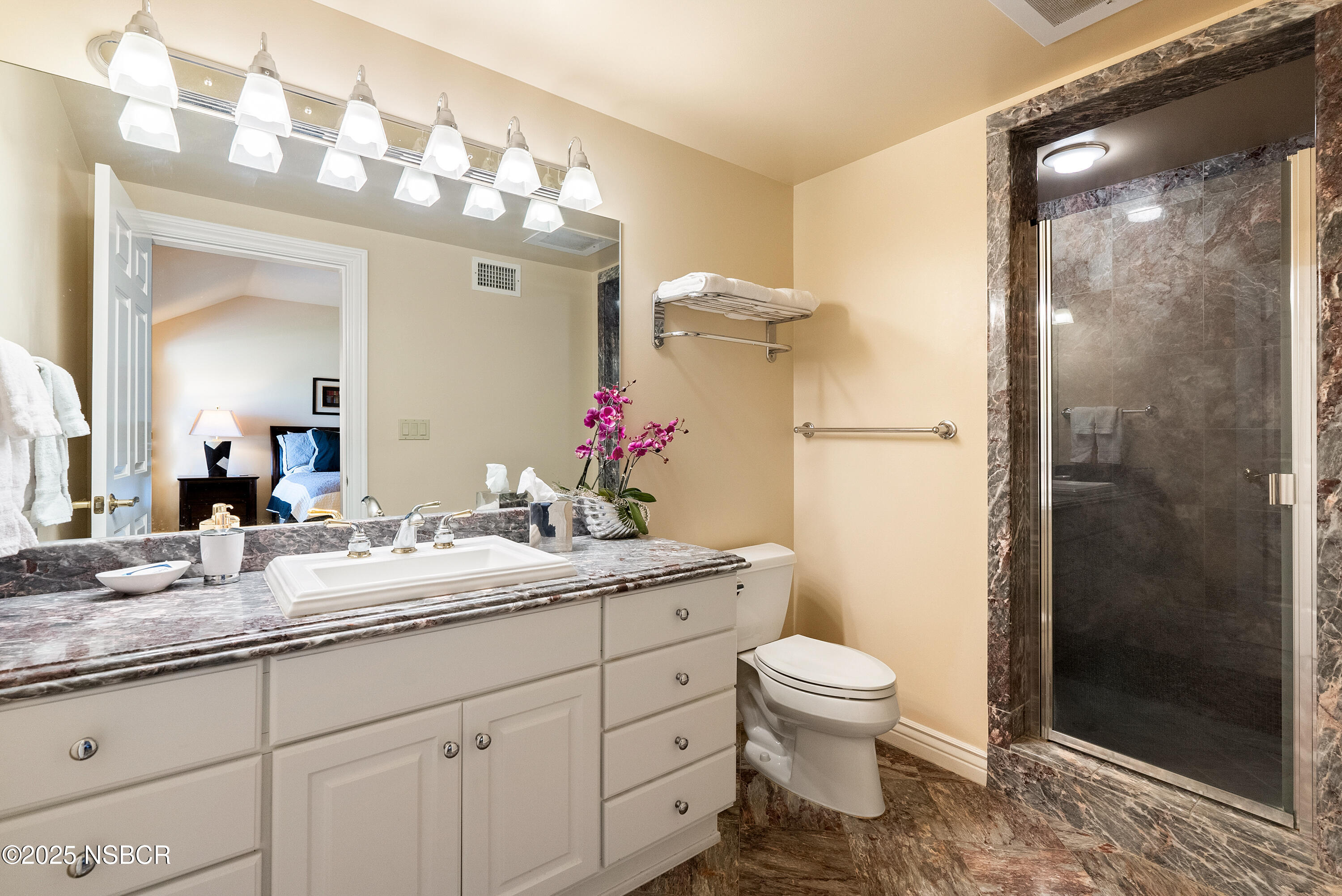 5010 Gate 4 Road Paso Robles, CA 93446 - Photo 22 of 57 a bathroom with a granite countertop sink toilet a mirror and shower