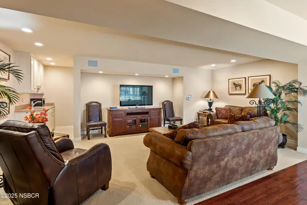 a bathroom with a granite countertop sink mirror and toilet