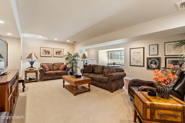 a view of a dining room with furniture window and outside view