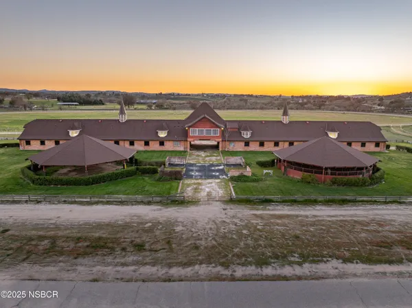 a view of a lake with couches chairs