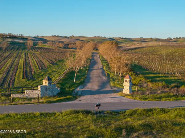 a view of swimming pool with a yard and mountain view