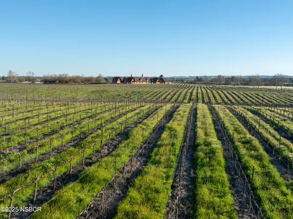a view of a lake with a yard
