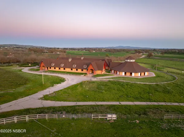 an aerial view of a house with a garden