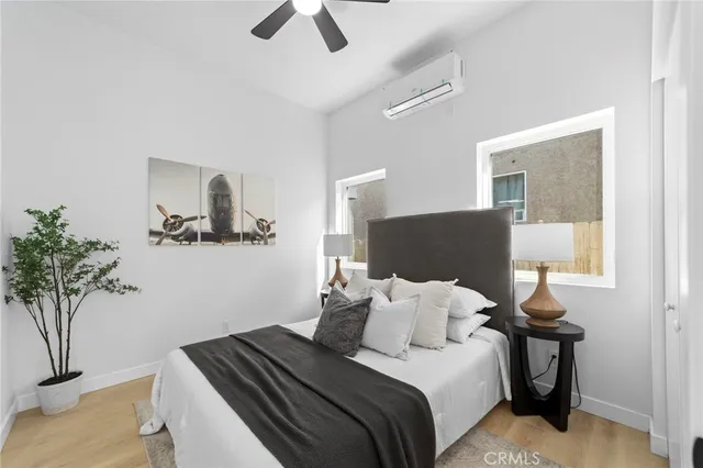 a bedroom with bed and window