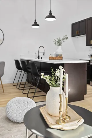 a dining room with furniture and chandelier