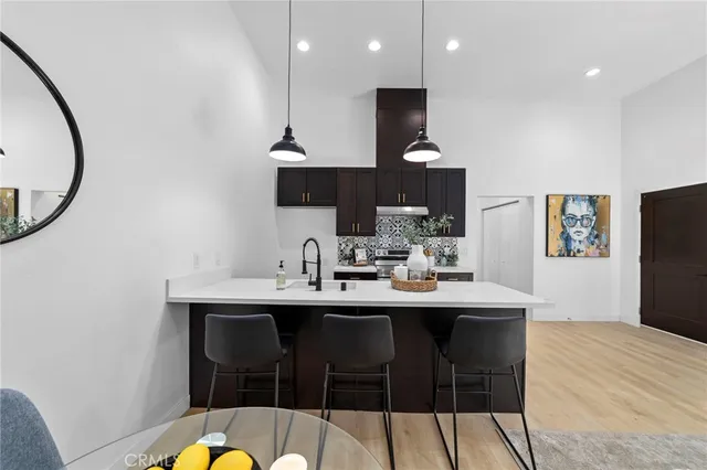 a kitchen with a table and chairs in it