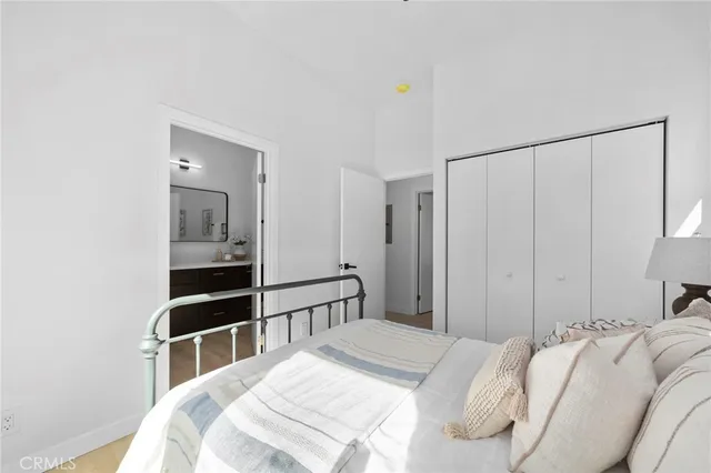 a bedroom with a bed and closet