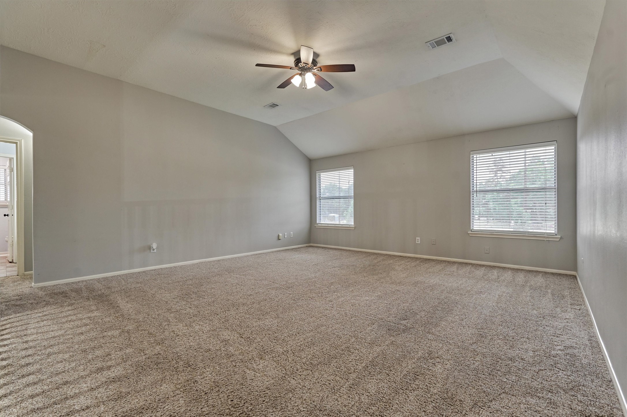 1618 Calmar Drive Spring, TX 77386 - Photo 19 of 30 an empty room with windows and fan