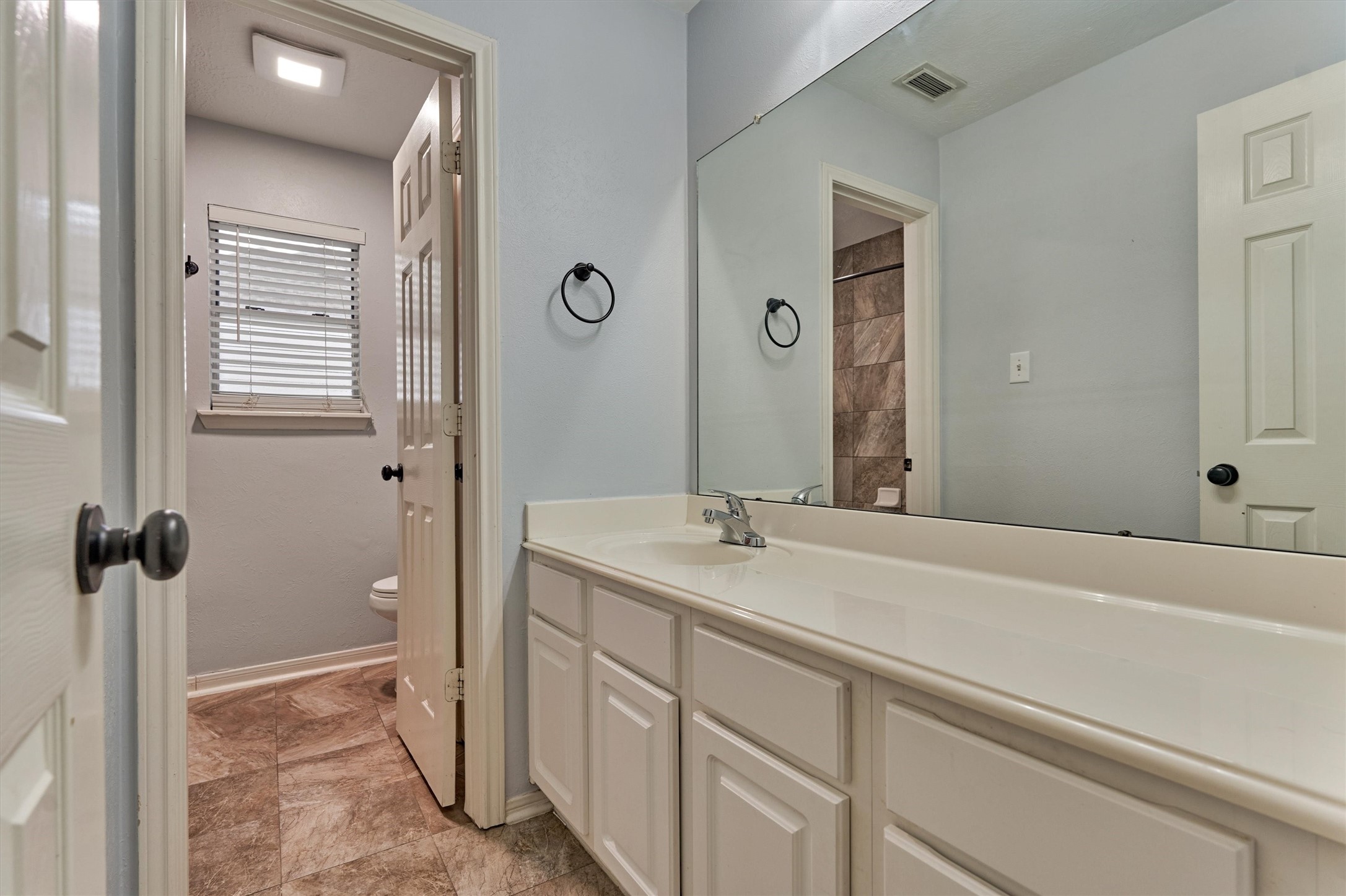 1618 Calmar Drive Spring, TX 77386 - Photo 23 of 30 a bathroom with a sink and a mirror with bathtub