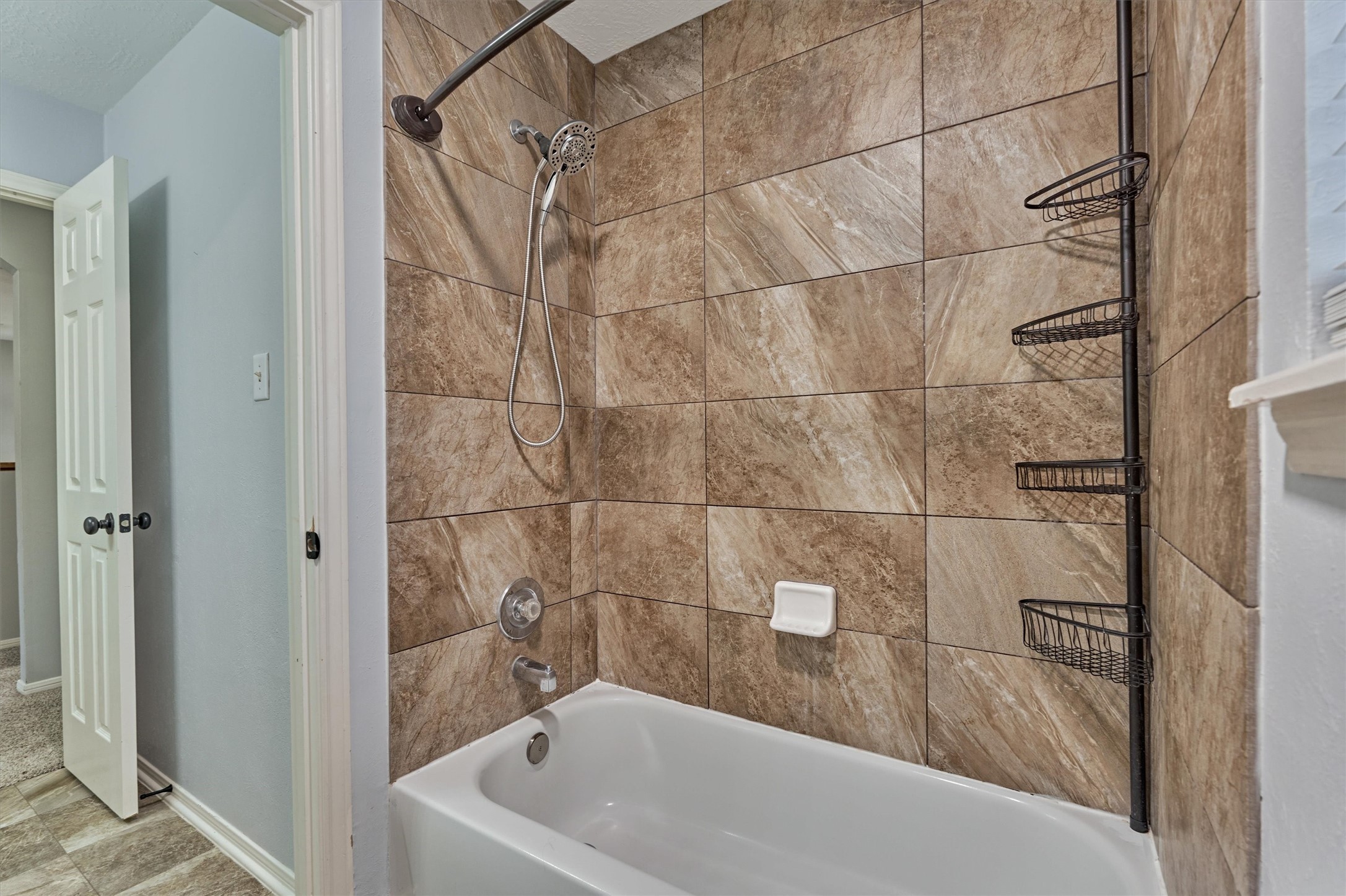 1618 Calmar Drive Spring, TX 77386 - Photo 24 of 30 a bathroom with a bathtub