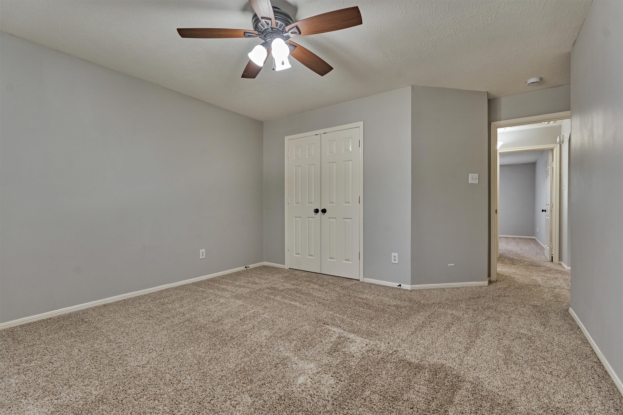 1618 Calmar Drive Spring, TX 77386 - Photo 26 of 30 an empty room with closet and a chandelier fan