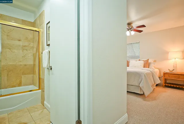 a bedroom with a bed and a shower
