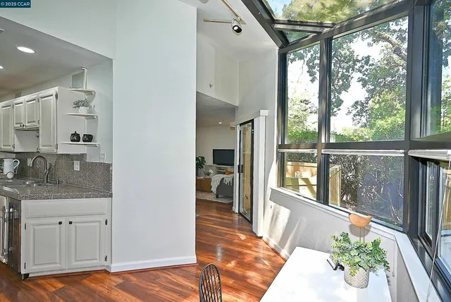 a view of a balcony with furniture