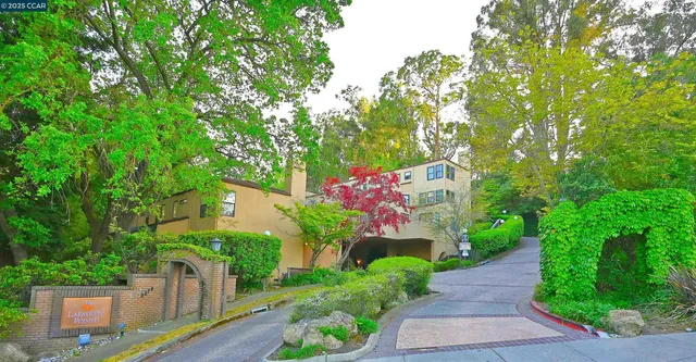 a front view of a house with a yard and a garage