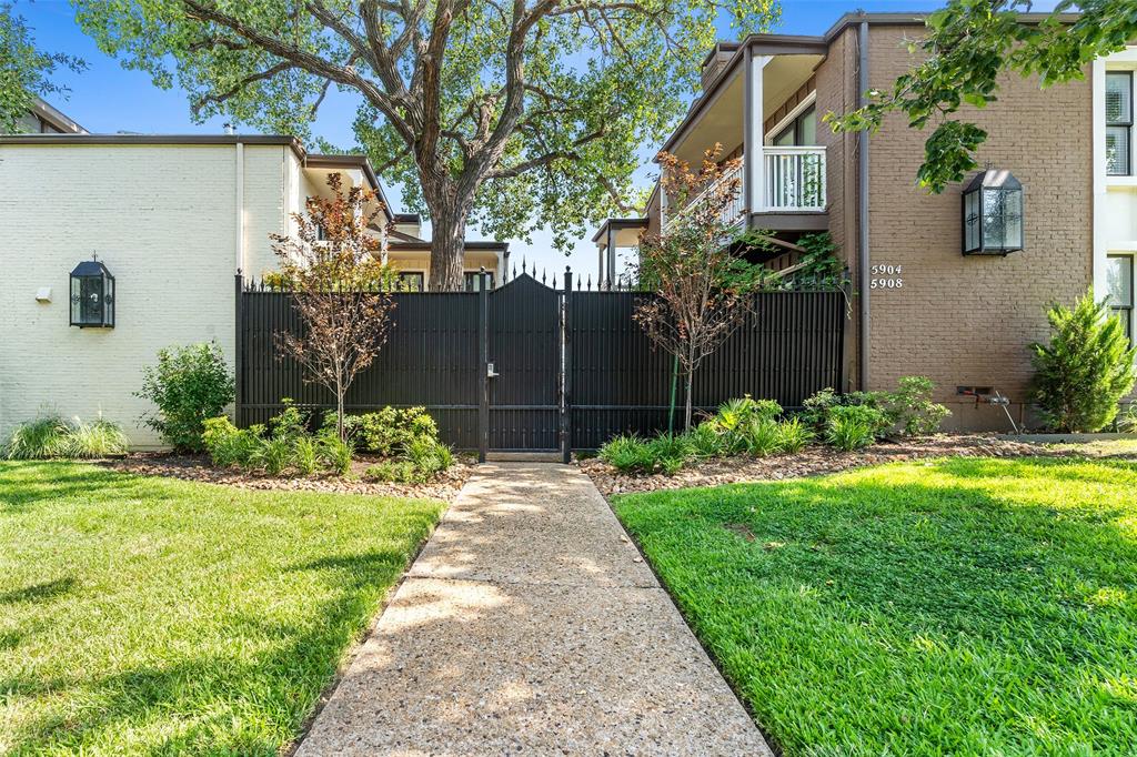 5904 Sandhurst Lane, Unit 147 Dallas, TX 75206 - Photo 1 of 19 a view of a back yard of the house