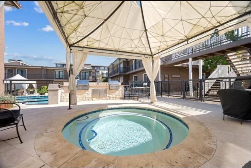 5904 Sandhurst Lane, Unit 147 Dallas, TX 75206 - Photo 17 of 19 an outdoor view with patio