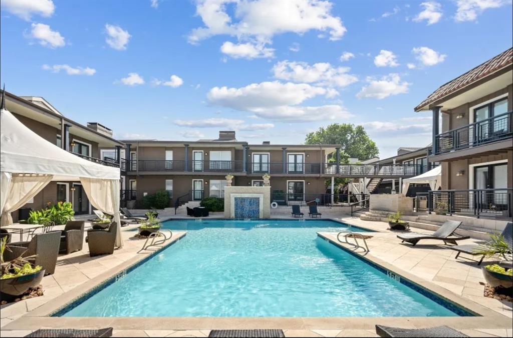 5904 Sandhurst Lane, Unit 147 Dallas, TX 75206 - Photo 19 of 19 a view of a house with swimming pool and sitting area