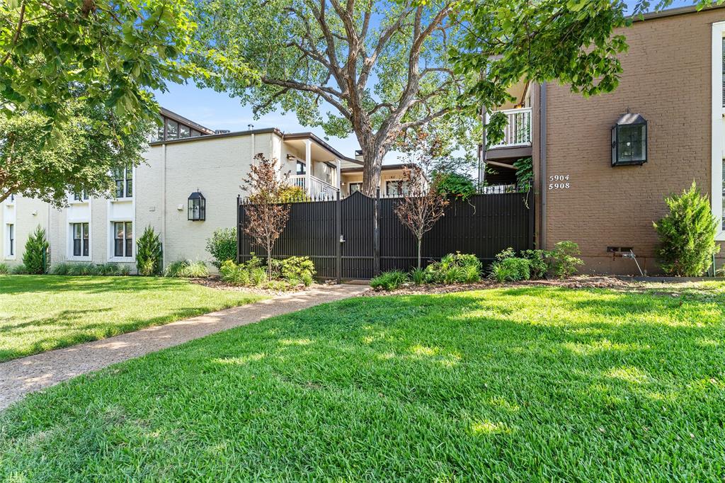 5904 Sandhurst Lane, Unit 147 Dallas, TX 75206 - Photo 2 of 19 a view of a house with backyard and sitting area