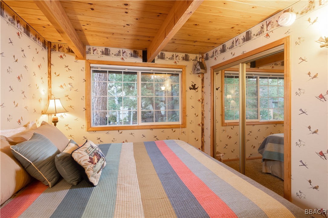 783 Thrush Drive Big Bear Lake, CA 92315 - Photo 14 of 24 a balcony with wooden floor and glass door