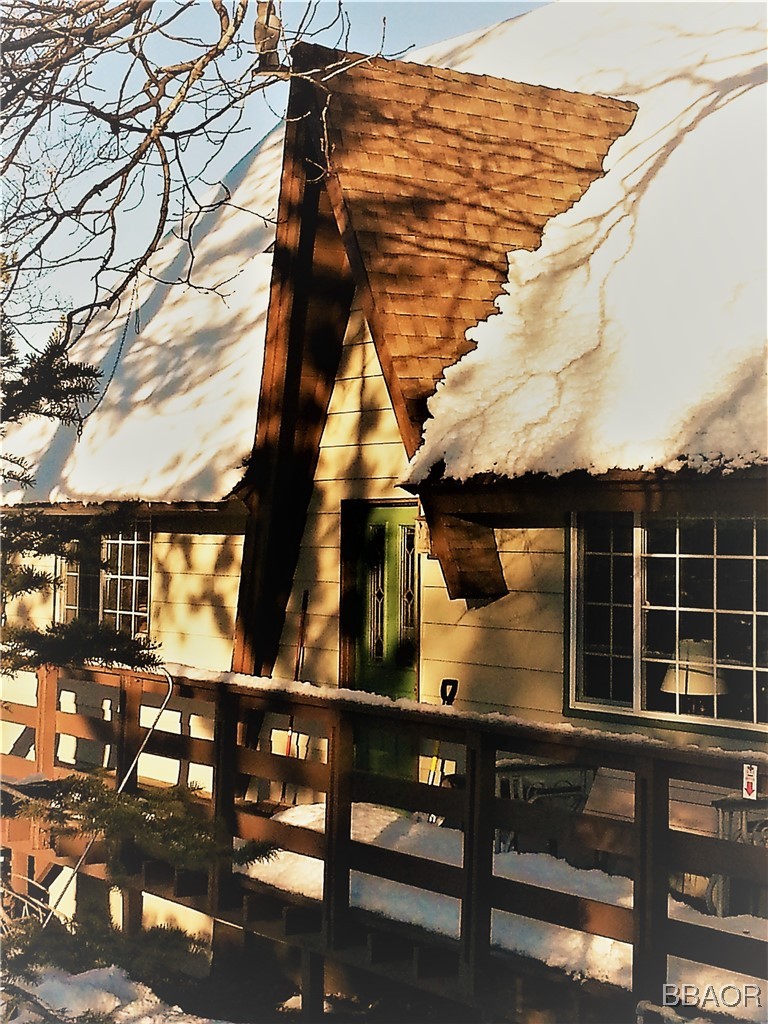 783 Thrush Drive Big Bear Lake, CA 92315 - Photo 24 of 24 a view of a roof deck with table and chairs with wooden floor and fence