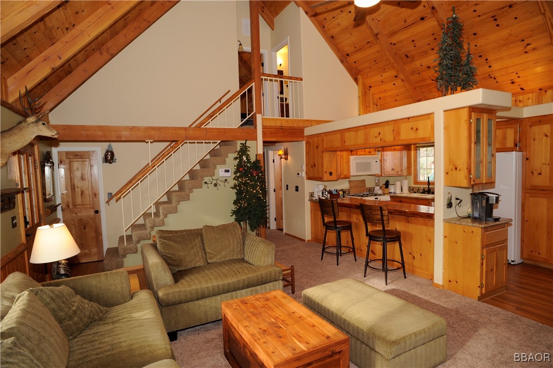 783 Thrush Drive Big Bear Lake, CA 92315 - Photo 4 of 24 a living room with furniture a ceiling fan and a rug