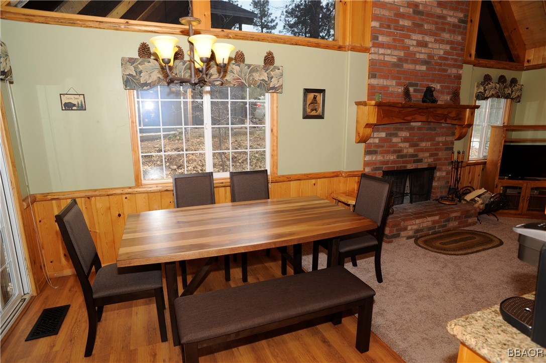 783 Thrush Drive Big Bear Lake, CA 92315 - Photo 8 of 24 a view of a dining room with furniture and a fireplace