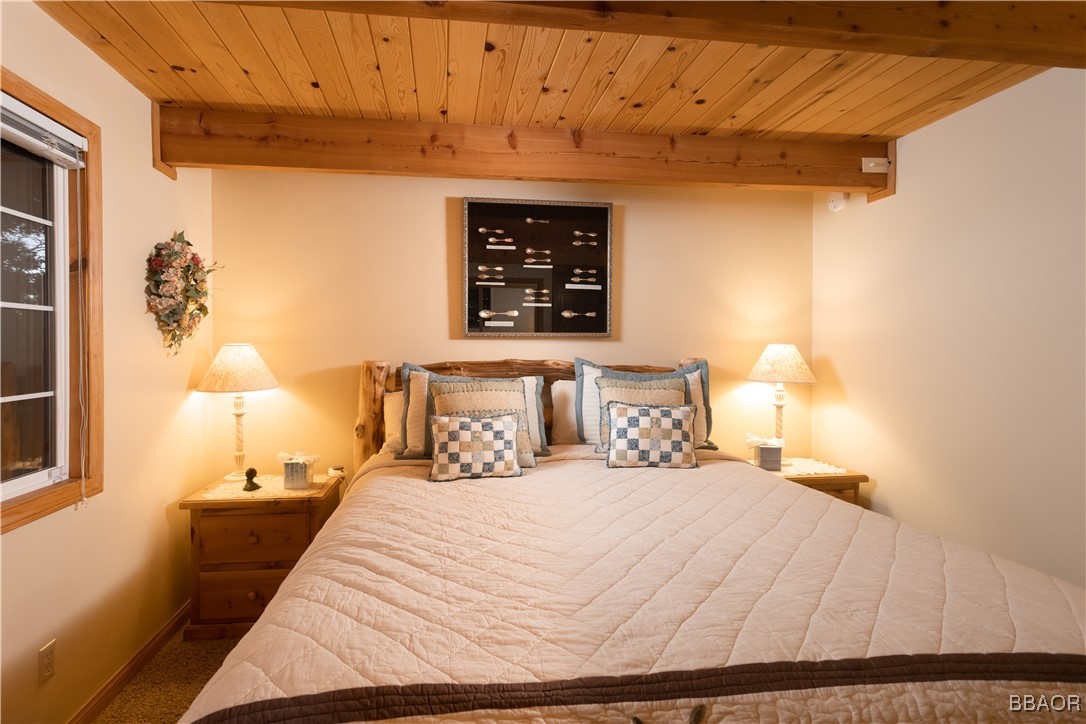 783 Thrush Drive Big Bear Lake, CA 92315 - Photo 10 of 24 a bedroom with a bed and a window