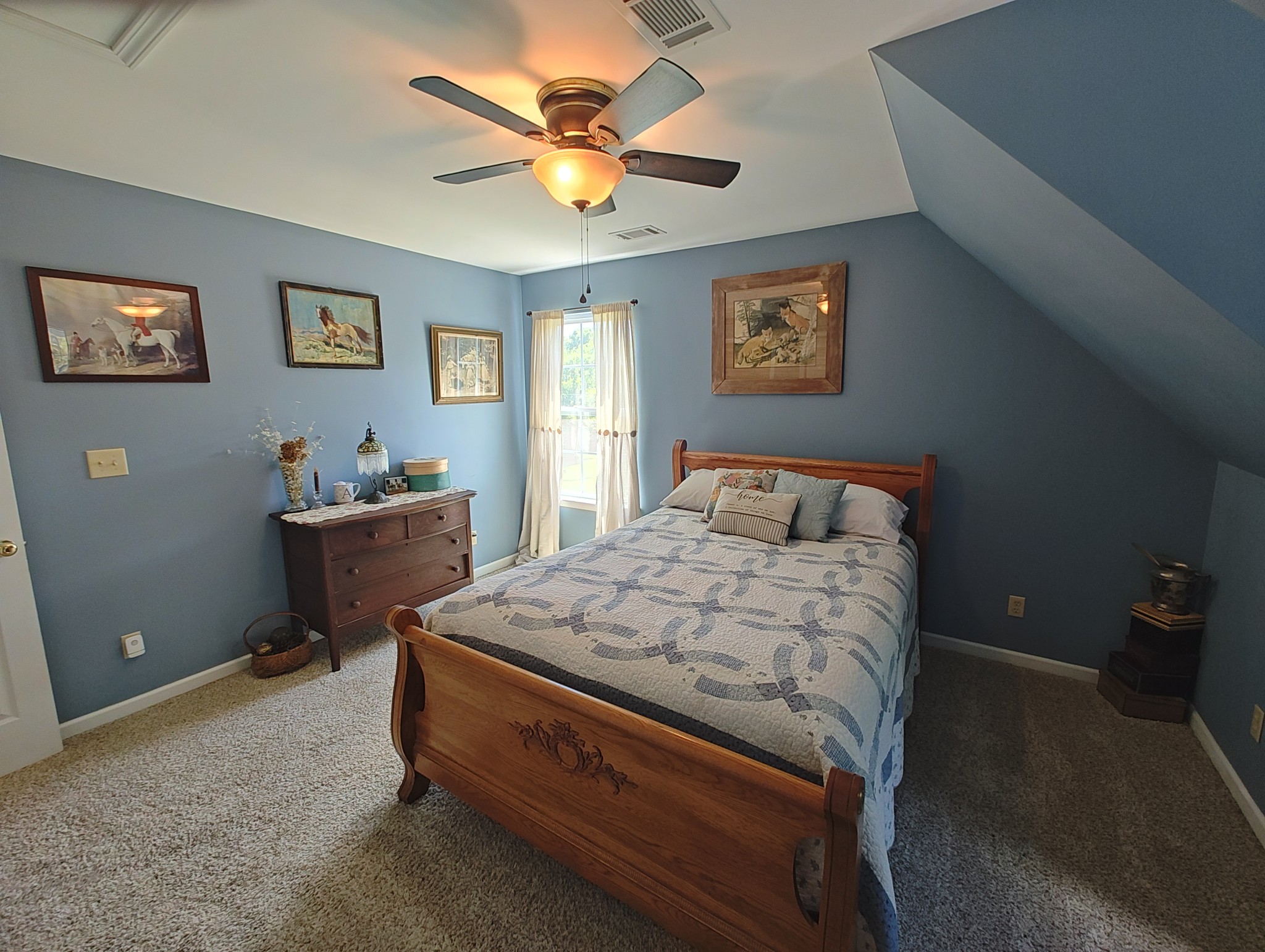 2770 Beech Log Road Watertown, TN 37184 - Photo 50 of 87 a bedroom with a bed and a chandelier