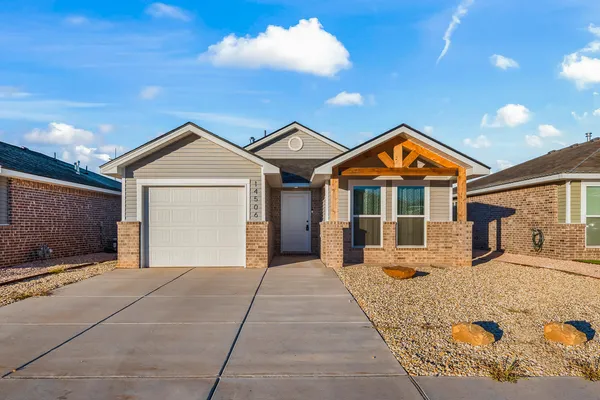 a front view of a house with yard