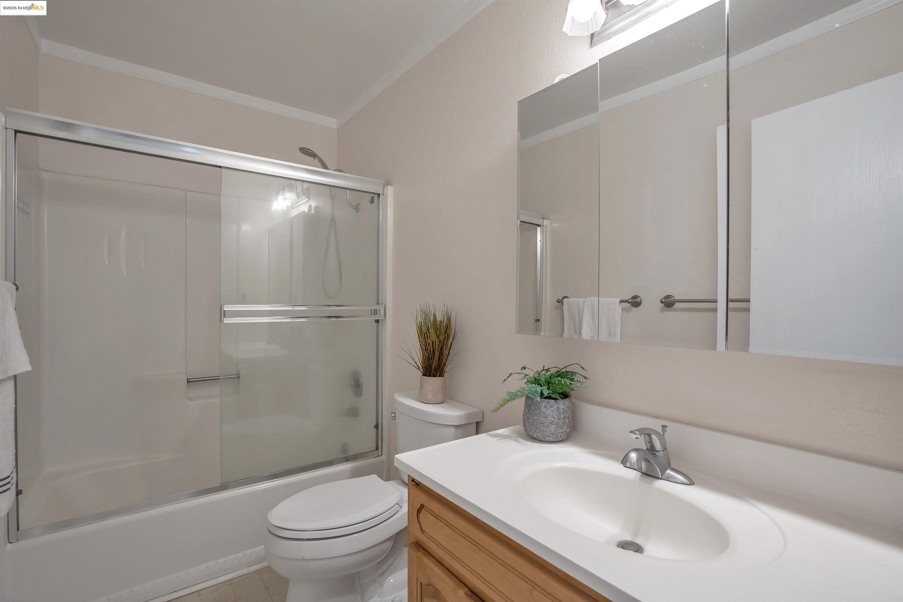15 Mateo Avenue, Unit 7 Millbrae, CA 94030 - Photo 17 of 25 a bathroom with a sink toilet and shower