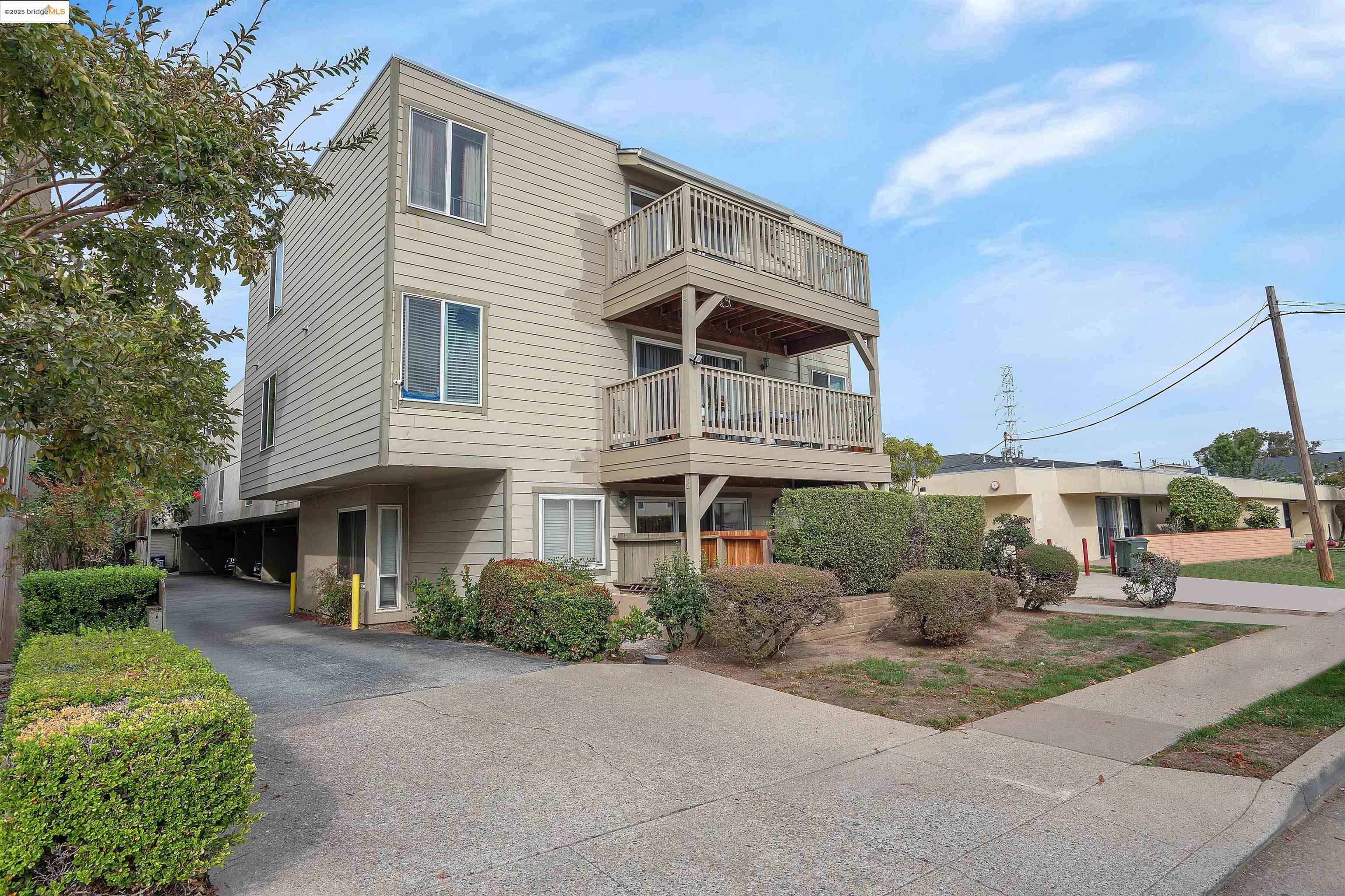 15 Mateo Avenue, Unit 7 Millbrae, CA 94030 - Photo 23 of 25 a front view of a house with yard and green space