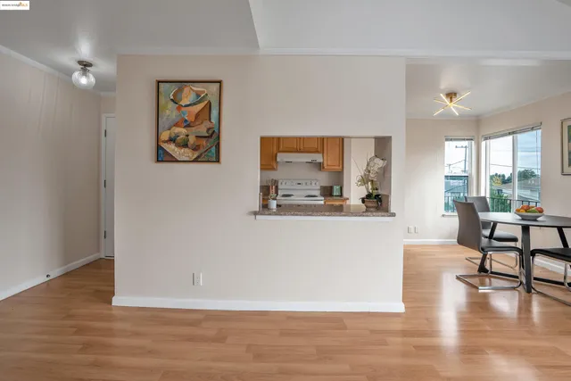 a view of a living room and wooden floor