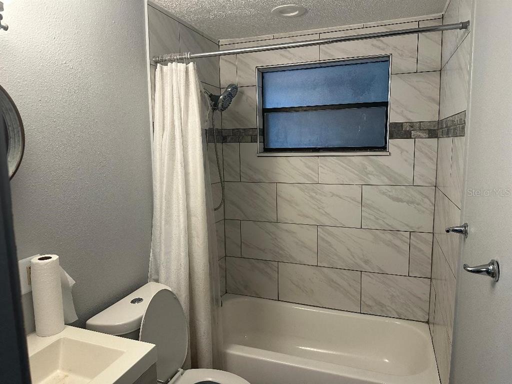 4048 Pecos Drive New Port Richey, FL 34653 - Photo 10 of 15 a bathroom with a tub and a toilet