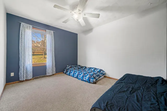 a bedroom with a bed and a dresser