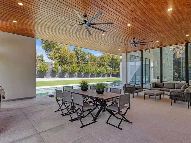 a view of an outdoor sitting area with furniture and garden view