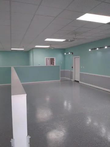 a room with furniture and white walls