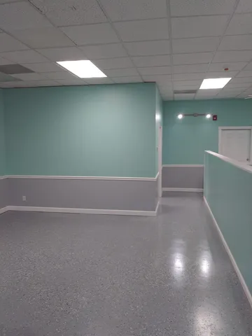 a living room with lots of furniture and toys