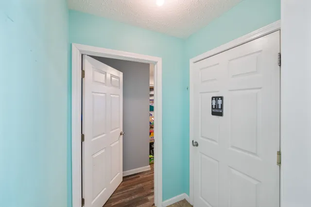 a white toilet sitting next to a bathroom sink