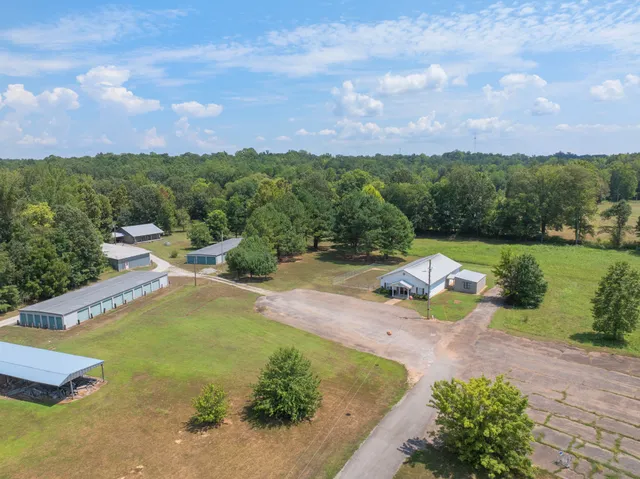 a view of a swimming pool with a yard